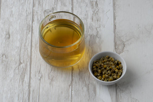 istock natural herbal tea with chamomile flowers 1214475427
