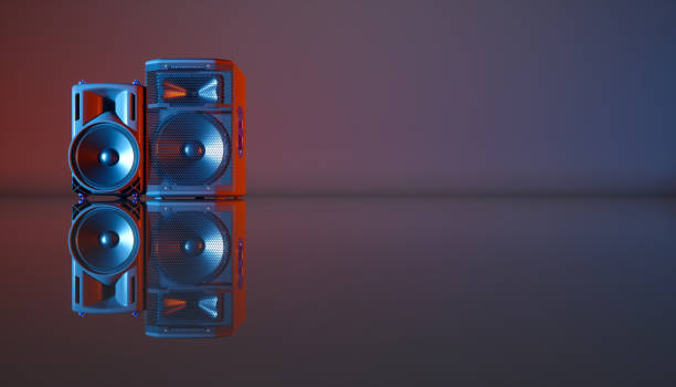 istock speaker system on a black background in blue and orange lighting 1214475443