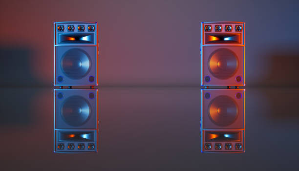 istock speaker system on a black background in blue and orange lighting 1214475458