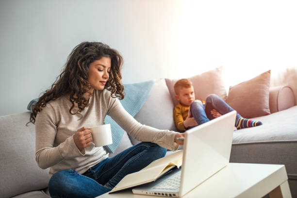 istock Millennial generation mother working from home with small children while in quarantine isolation during the Covid-19 health crisis 1214476668