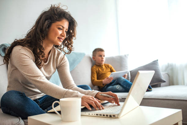 istock Busy young woman with son at home. 1214476809
