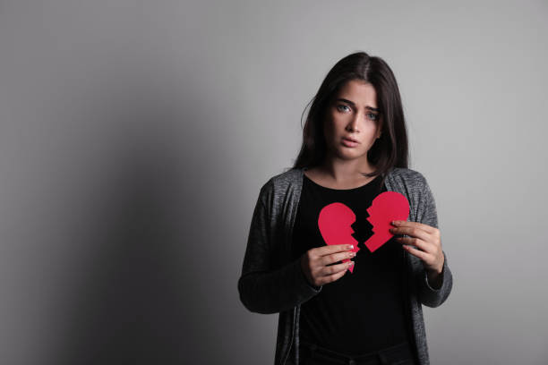 istock Sad woman with broken heart 1214478456