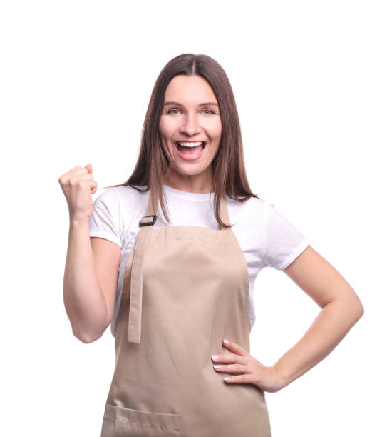 Young woman in apron isolated on white background