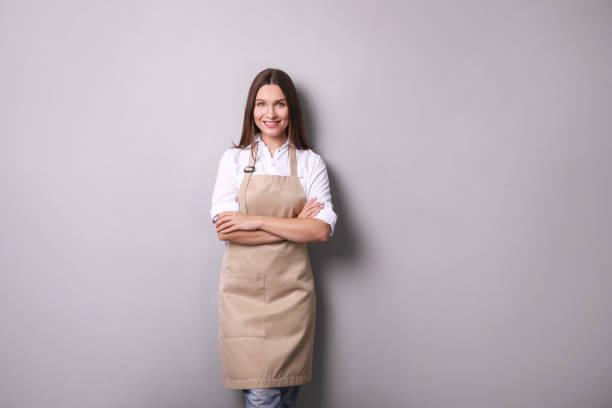 istock Young woman in apron portrait 1214480118