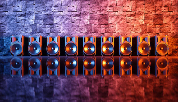 istock speaker system on a black background in blue and orange lighting 1214482505