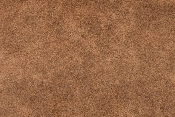 istock Brown artificial leather structure matt surface of brown pleather 1214482506