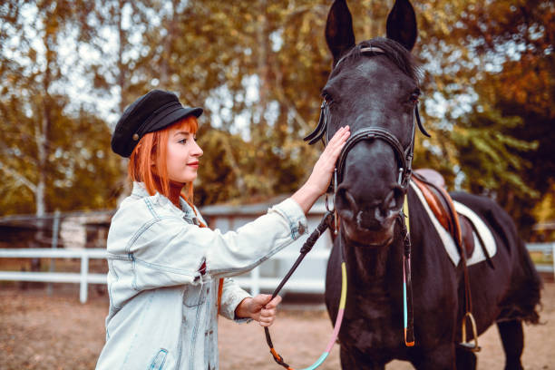 Female Beauty Petting Her Mare