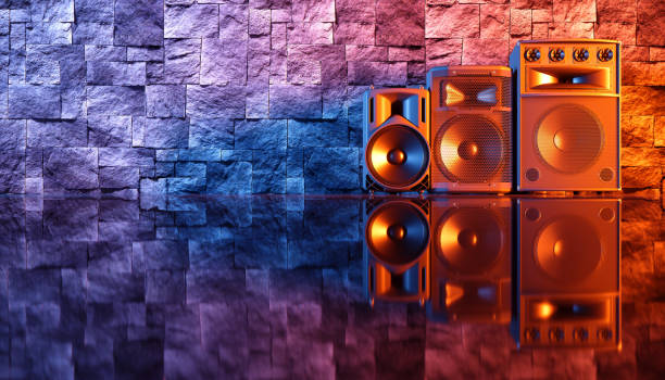 istock speaker system on a black background in blue and orange lighting 1214483053