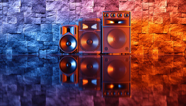 istock speaker system on a black background in blue and orange lighting 1214483128
