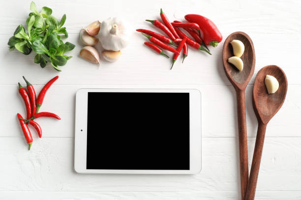 istock Online recipe tablet with vegetables and spices 1214483472