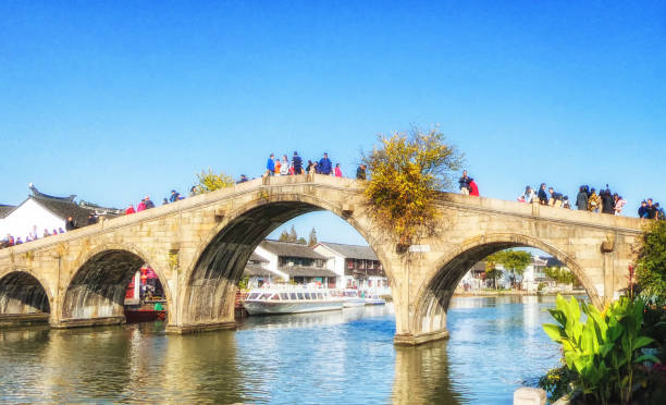 Bridge across the canal in Zhujiajiao water town. Shanghai, China - November 15, 2019 : Bridge across the canal in Zhujiajiao water town. Zhujiajiao stock pictures, royalty-free photos & images