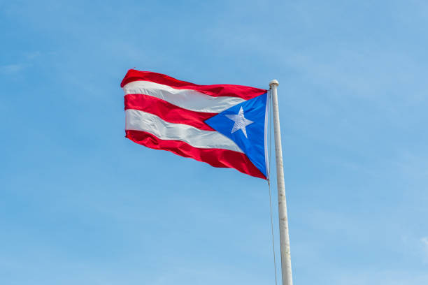 istock Puerto Rico flag fluttering in the wind on the flagpole 1214483591