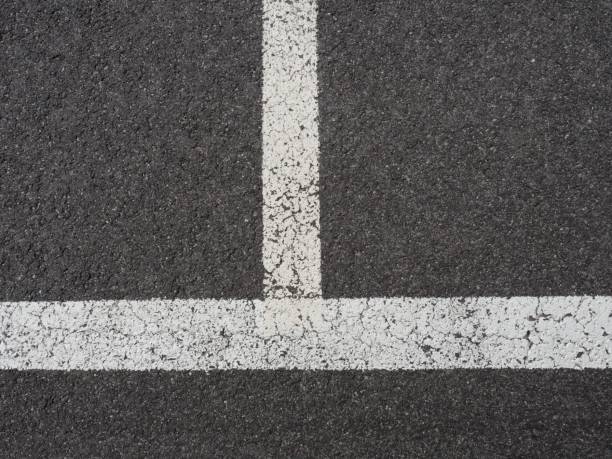 istock Lines painted with white color on empty parking spaces 1214483689