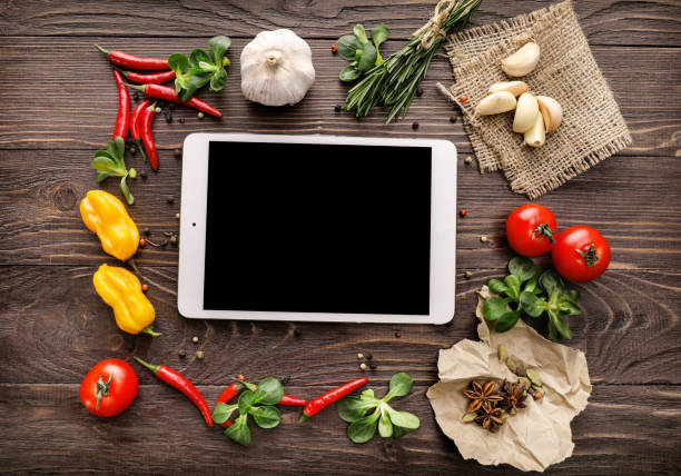 istock Online recipe tablet with vegetables and spices 1214483766