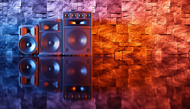 istock speaker system on a black background in blue and orange lighting 1214483780