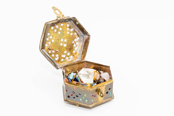 istock Raw diamond dob between colorful gemstones in old jewelry box 1214484348
