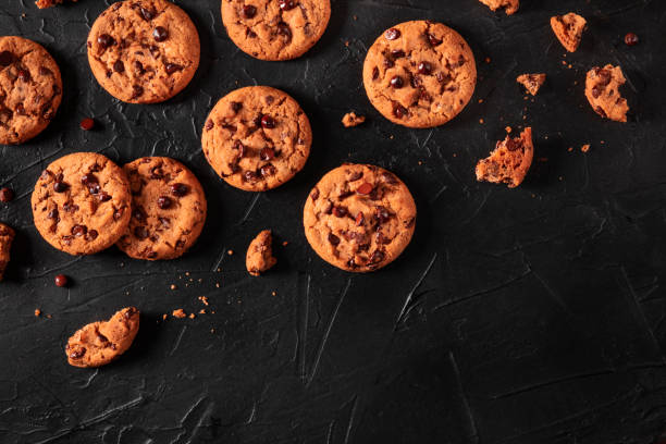 istock Chocolate chip cookies on a dark background, shot from above with copy space 1214484701