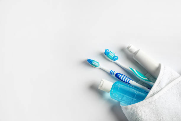 Various dental products in white towel
