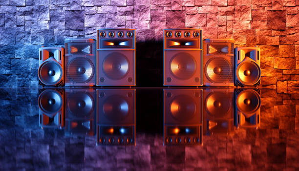 istock speaker system on a black background in blue and orange lighting 1214485335