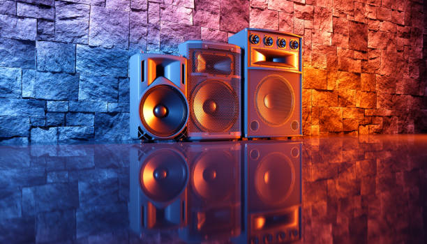 istock speaker system on a black background in blue and orange lighting 1214485368