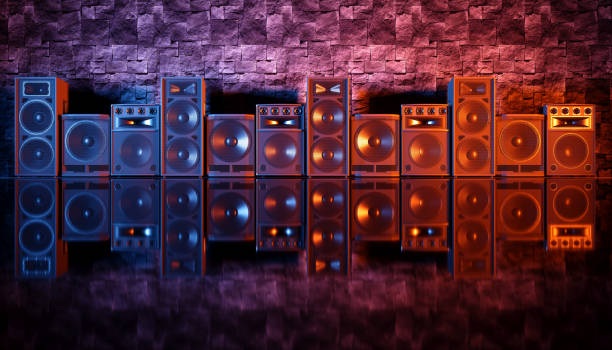 istock speaker system on a black background in blue and orange lighting 1214485559