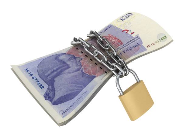 istock British pound UK money lock security protection 1214486184