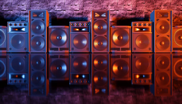 istock speaker system on a black background in blue and orange lighting 1214487065