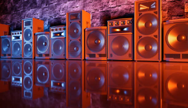 istock speaker system on a black background in blue and orange lighting 1214487152