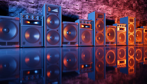 istock speaker system on a black background in blue and orange lighting 1214487649