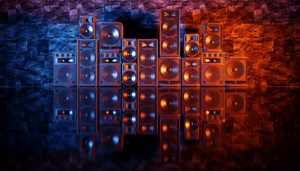 istock speaker system on a black background in blue and orange lighting 1214488340
