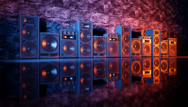 istock speaker system on a black background in blue and orange lighting 1214488409