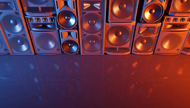 istock speaker system on a black background in blue and orange lighting 1214488489