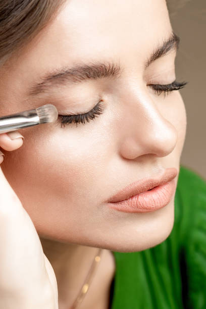 istock Woman applying eyeshadow powder. 1214488602