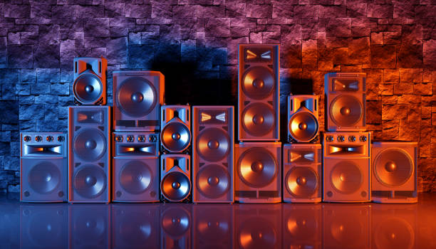 istock speaker system on a black background in blue and orange lighting 1214488743