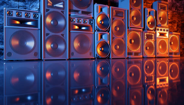 istock speaker system on a black background in blue and orange lighting 1214488882
