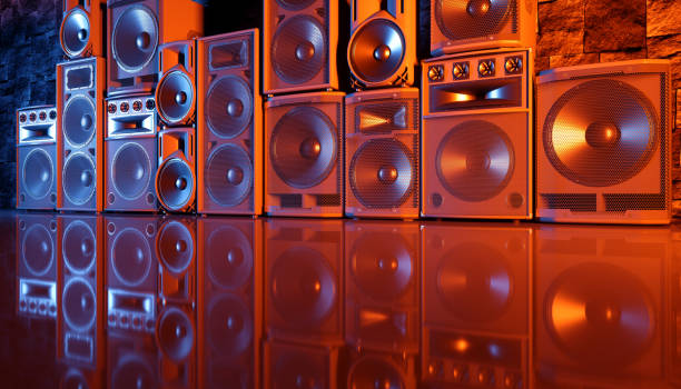 istock speaker system on a black background in blue and orange lighting 1214489009
