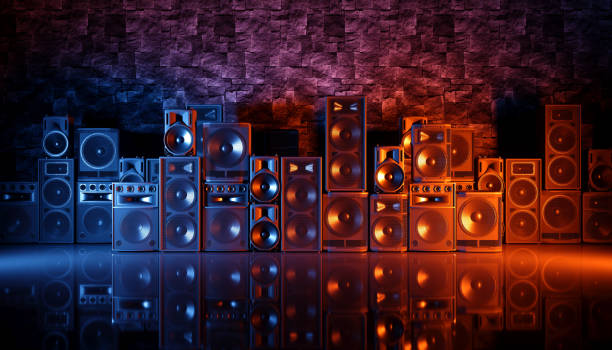 istock speaker system on a black background in blue and orange lighting 1214489177