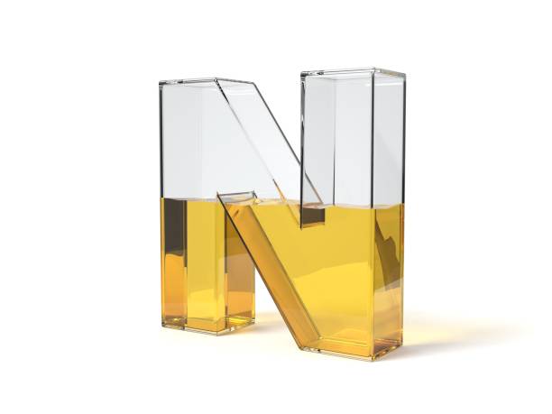 istock letter N shaped glass half filled with yellow liquid. 3d illustration 1214489285
