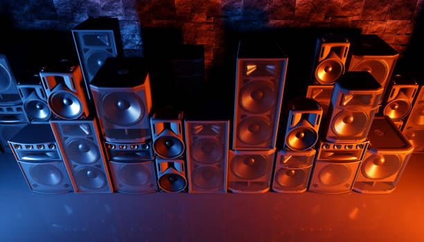 istock speaker system on a black background in blue and orange lighting 1214489304