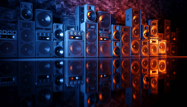 istock speaker system on a black background in blue and orange lighting 1214489870