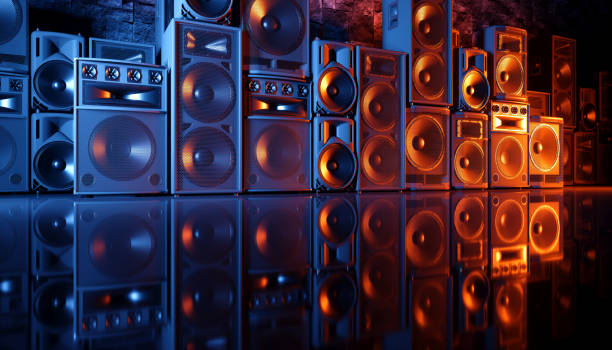 istock speaker system on a black background in blue and orange lighting 1214489933