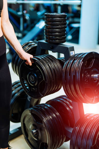 istock Huge pancakes for a dumbbell in a gym. 1214490139