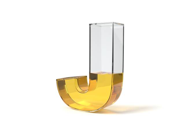 istock letter J shaped glass half filled with yellow liquid. 3d illustration 1214490333
