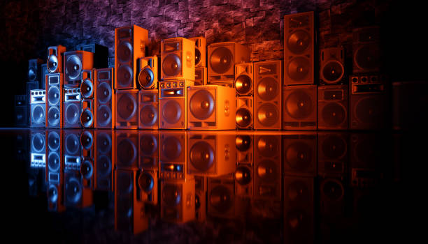 istock speaker system on a black background in blue and orange lighting 1214490351