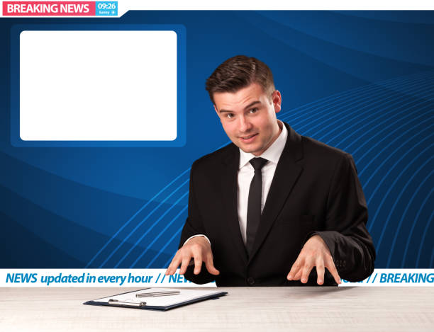 istock Television reporter telling breaking news at his studio desk with copy space 1214490385