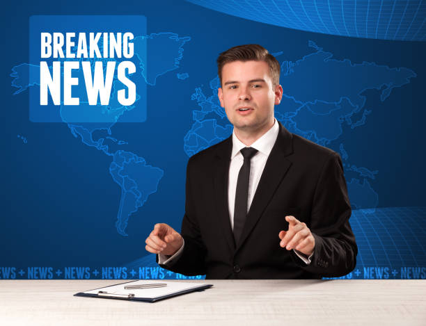 istock Television presenter in front telling breaking news with blue modern background 1214490438