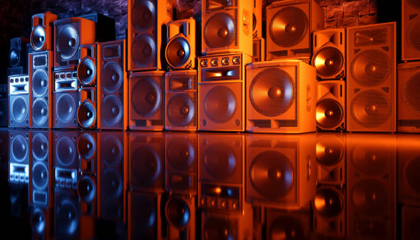 istock speaker system on a black background in blue and orange lighting 1214490606