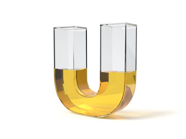istock letter U shaped glass half filled with yellow liquid. 3d illustration 1214491043