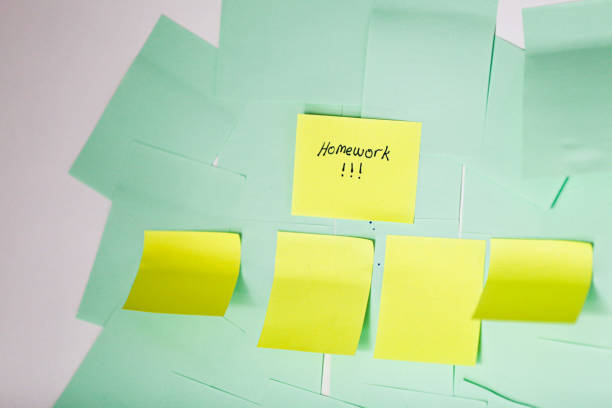 istock Blank Note Paper and Scheduled Sticker Homework 1214492254