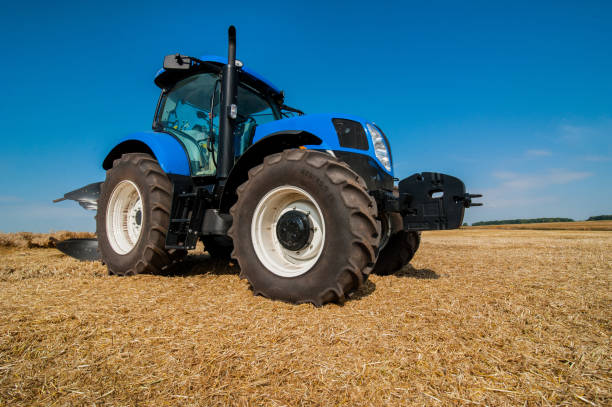 istock New blue tractor working on the field, modern agricultural vehicle 1214493063